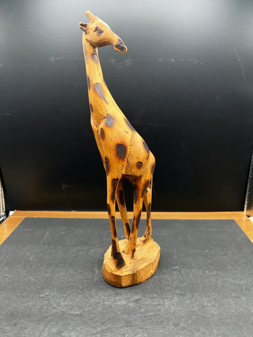 #2008B Vintage Hand Carved Giraffe, 12 1/2β Tall X 4β Wide, African Souvenir
Tip Of One Ear Chipped And One Antler/Horn Is Broken.