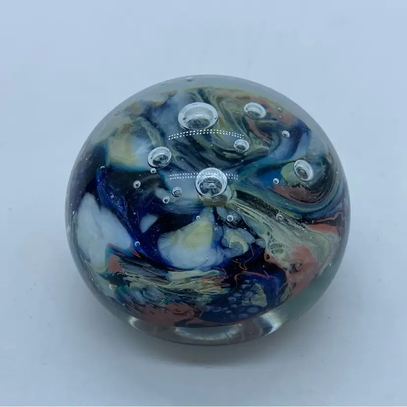 #0045 signed and dated 1977 Edward Roman art glass paperweight with swirls and bubbles.