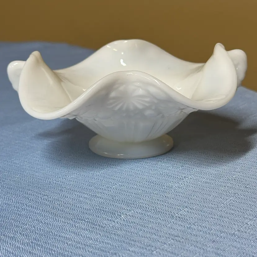 Fenton Daisy and Button milk glass footed candy dish with a crimped lip 5.5”