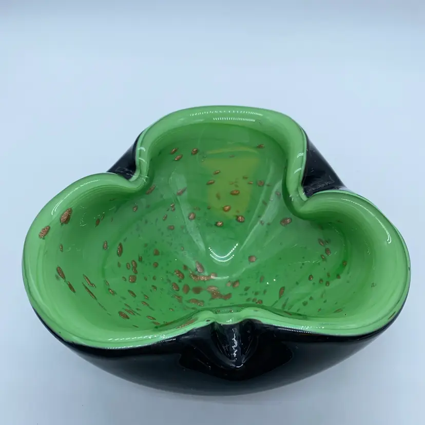 #1219 A black and green Murano glass bowl with copper/gold aventurine inclusions.