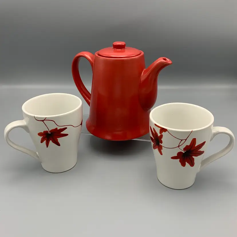 Red Coffee/Tea Pot  with lid
2 white coffee/tea mugs w/red flowers