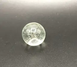 Single clear 1" art glass shooter marble bubble -has defect in glass