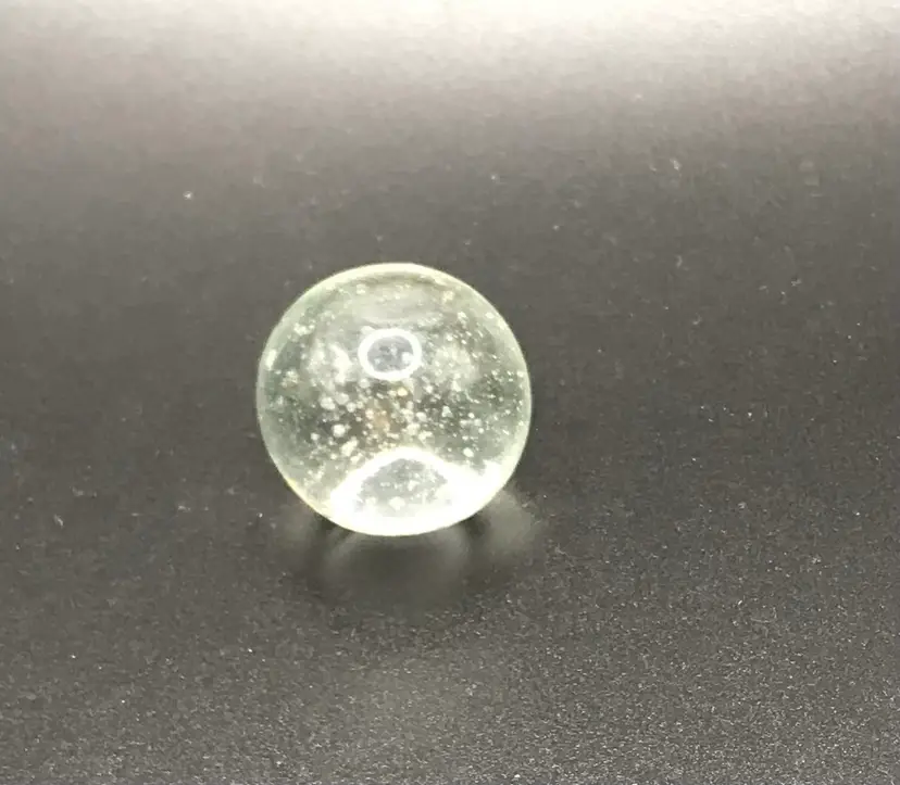 Single clear 1" art glass shooter marble bubble -has defect in glass