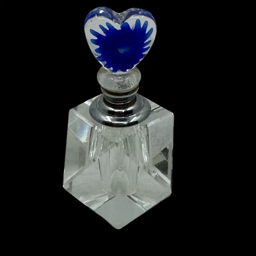 Faceted glass perfume bottle with a blue Floral glass Heart Shaped stopper.