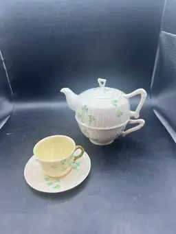 Beleek Teapot With with tea cup underneath and a small teacup