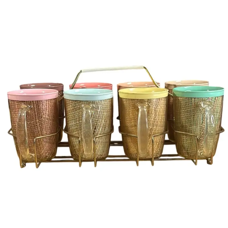 Eight MCM Thermal Raffiaware Mugs with Goldtone Metal Holder