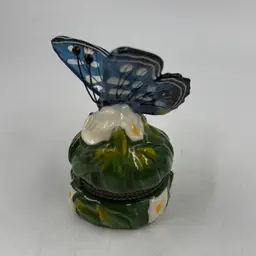 Vintage Blue And White Butterfly Trinket Box With A Little Yellow Butterfly Inside.  Has Paint Loss On The Bottom 
Note: Photos For Flaws