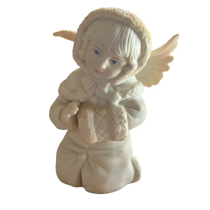 Russ Berrie porcelain figurine titled "Little Miracles Angel with Muff”