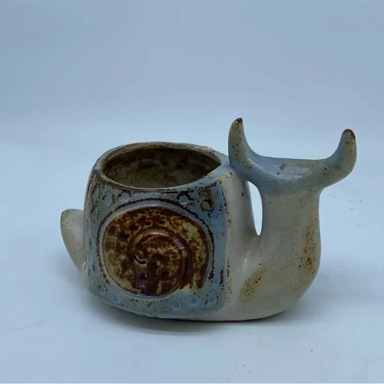 #4901 Handcrafted ceramic snail planter with a whimsical design.