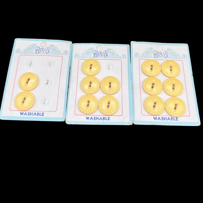 #197A Lot Of 13 Vintage BWG Brand Washable Yellow Plastic Buttons With A Sunburst Or Scalloped Design. These Buttons We’re Manufactured Between The 1940’s - 1960’s. All Are On Original Cards, One Full Set, Two Partials. 3/4” In Diameter