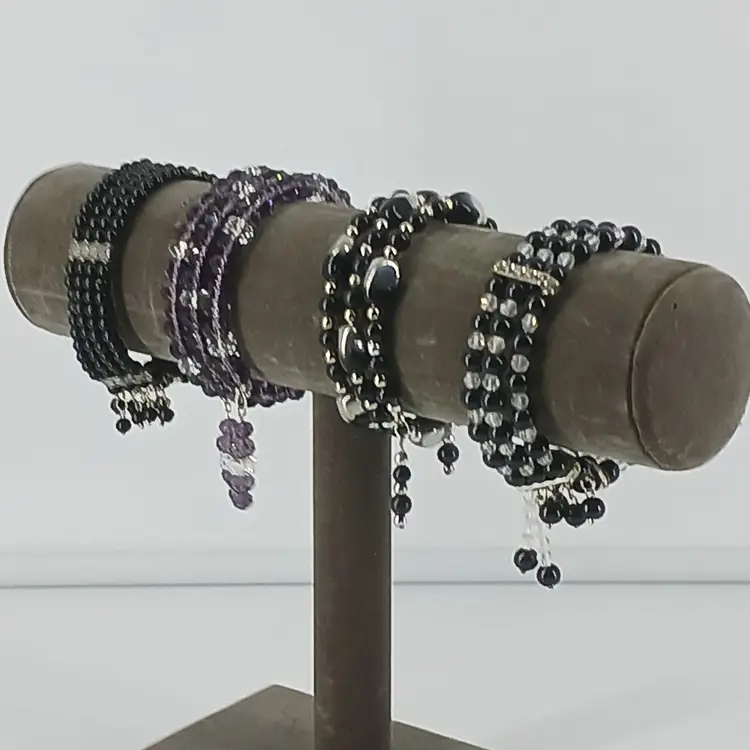 Four Black Glass Coil Bracelets