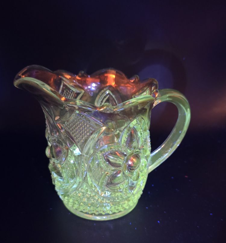 Vintage Clear Glass Pitcher with Embossed Floral Motif – Gold Accents & Manganese Glow