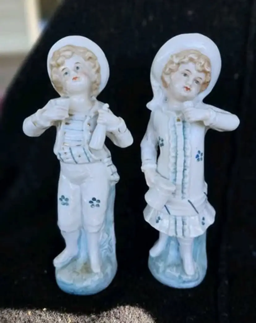 Pair of girl and boy 7.5" figurines from Germany AS IS