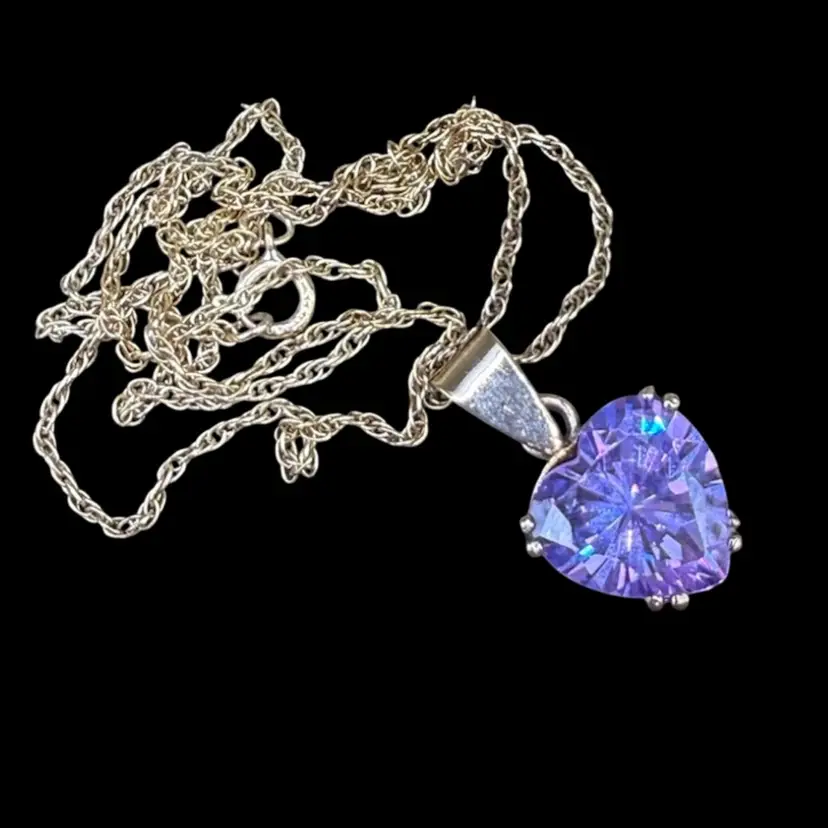 a sterling silver large purple crystal heart pendant necklace.