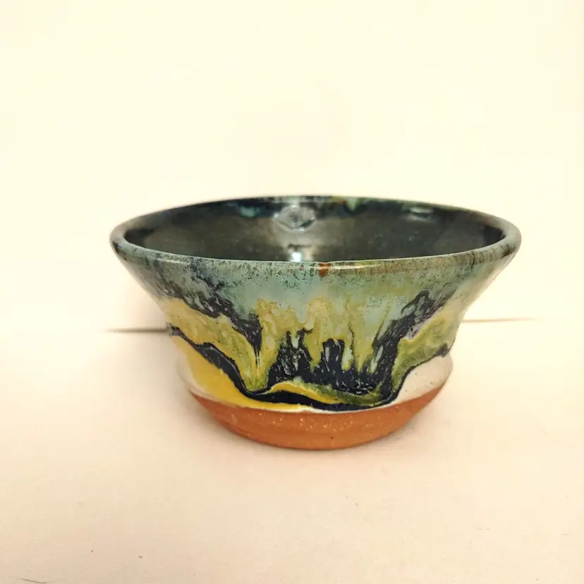 Signed pottery bowl. 5.5 inch diameter. No chips or cracks.