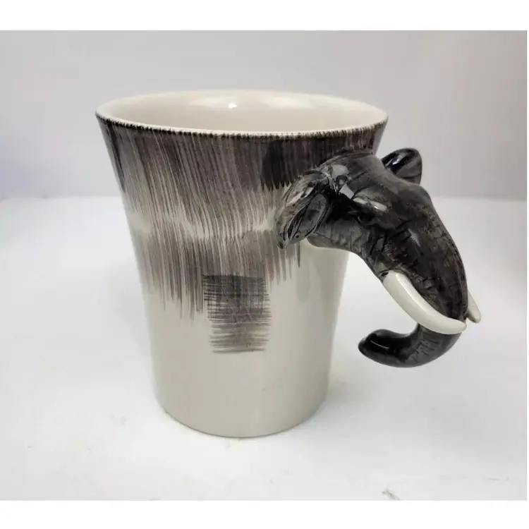 Pier 1 One Imports 3D Elephant Head Trunk Handle Coffee Mug Cup 
16 oz Gray White
