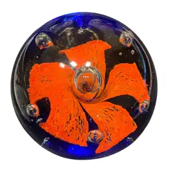Large Paperweight With Orange Flower, Controlled Bubbles And Base Is Blue.