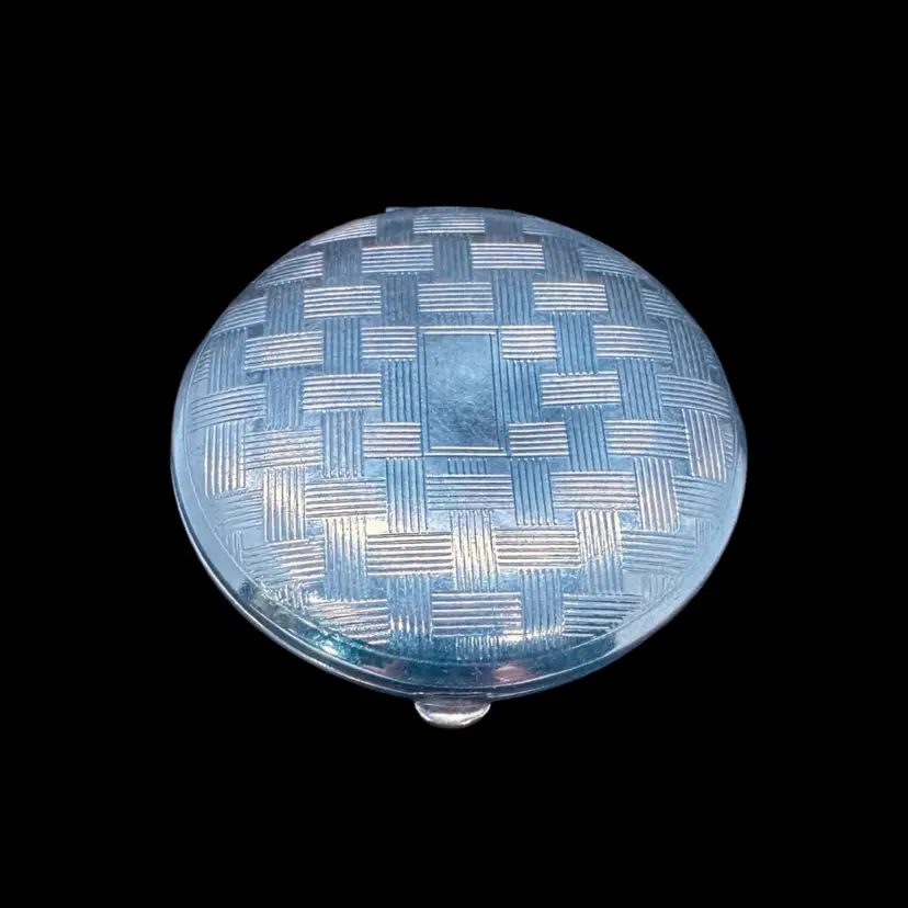 20. 1930s Richard Hudnut "Three Flowers" powder compact. Silver-tone Art Deco crosshatch design