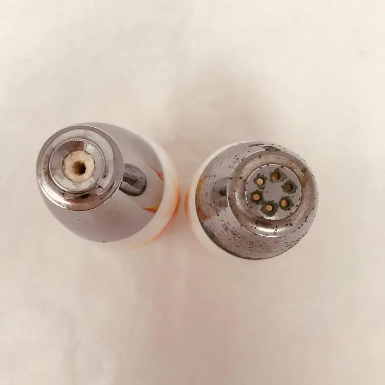 Westinghouse milk glass groovy salt and pepper shakers, orange slices design. 1960s. Small paint loss on salt shaker, corrosion on metal tops consistent with age (please see photos) Westinghouse mark on underside. 3.75 H x 1.5 W