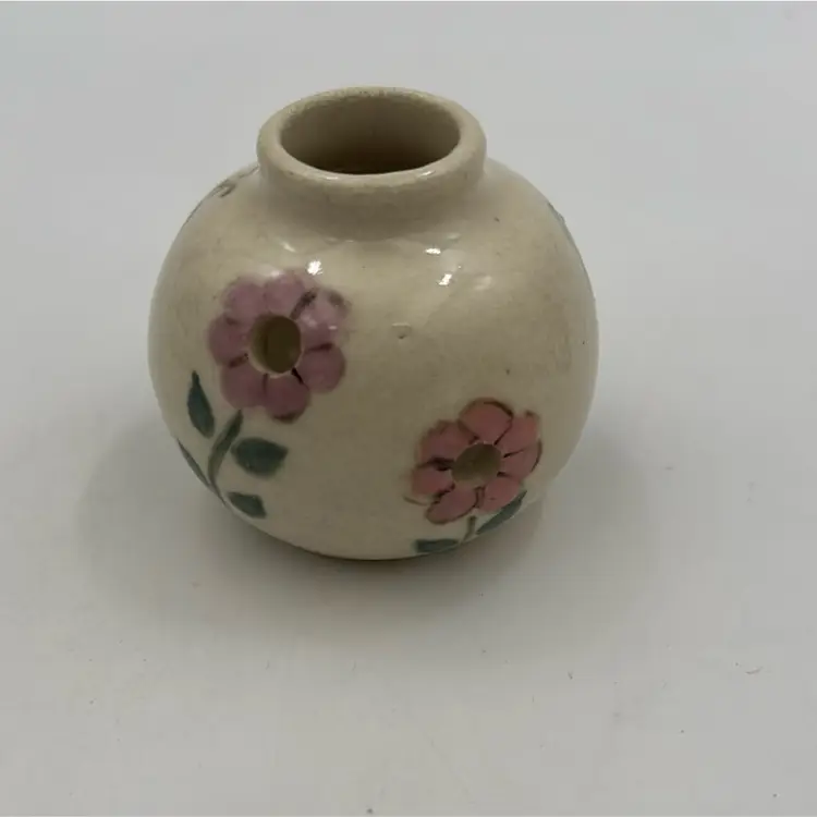 Small Handcrafted Pottery Diffuser With A 🐝 has a makers mark