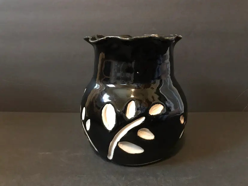 Artisan Pottery Black Ruffled Top With White Leaf Design Vase. Signed