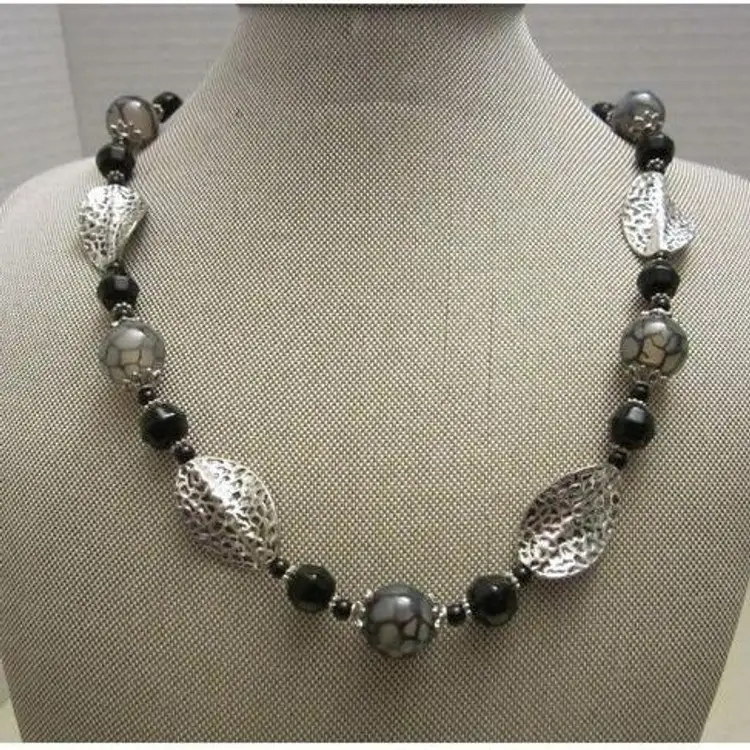 Black and marbled glass beaded necklace with silver twisted leaf necklace