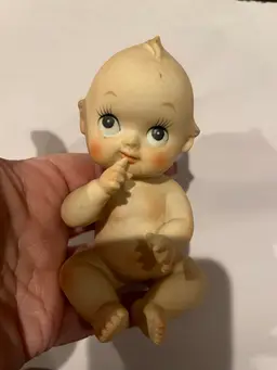 Kewpie Doll Hand At Mouth