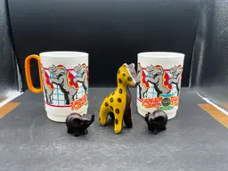 Vignette #7 Includes A Vintage Pair Of 1990s Ringling Bros Barnum & Bailey Circus Cup Elephants, Two Miniature Elephant Figurines - Composite Or Wood In Dark Finish, And A Miniature Ceramic Painted Giraffe