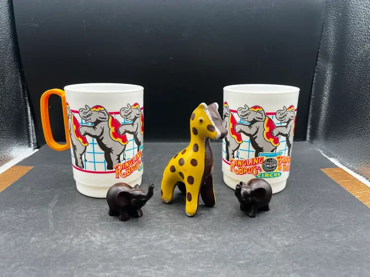 Vignette #7 Includes A Vintage Pair Of 1990s Ringling Bros Barnum & Bailey Circus Cup Elephants, Two Miniature Elephant Figurines - Composite Or Wood In Dark Finish, And A Miniature Ceramic Painted Giraffe