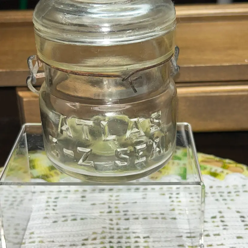 Vintage Atlas E-Z Seal 1/2 pint clear glass mason canning jar with a wire bail.