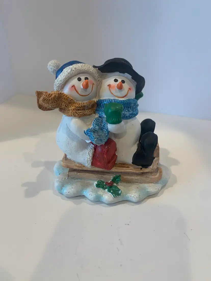 Snowman Couple Figurine Sledding