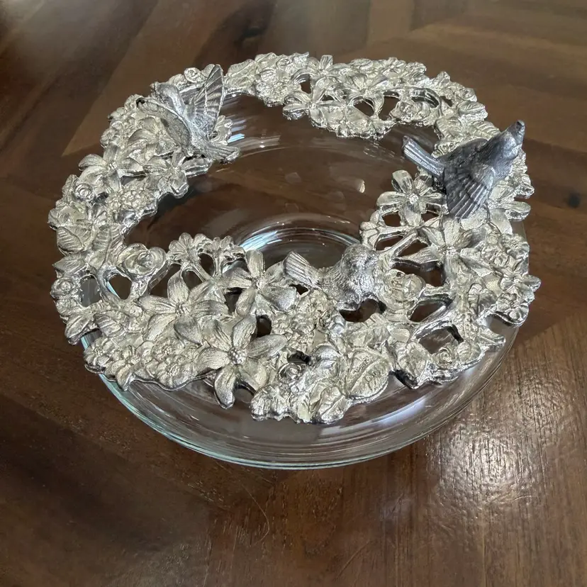 Glass potpourri jar with a decorative metal surround.