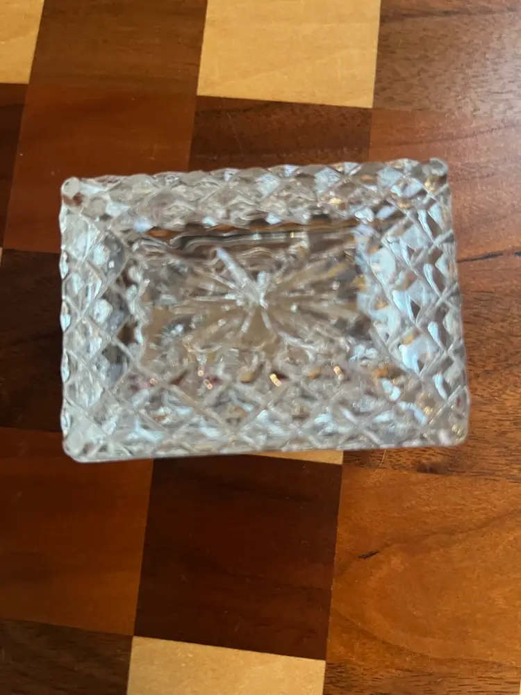 A vintage clear glass lidded trinket box with diamond cut patterns. 3”x2” X2”