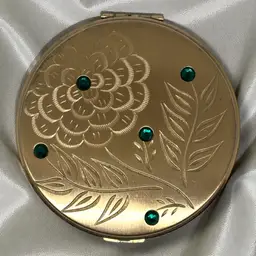 Vintage Large Gold Tone Metal And Rhinestone Engraved Flower Compact. 4 Inches Diameter.