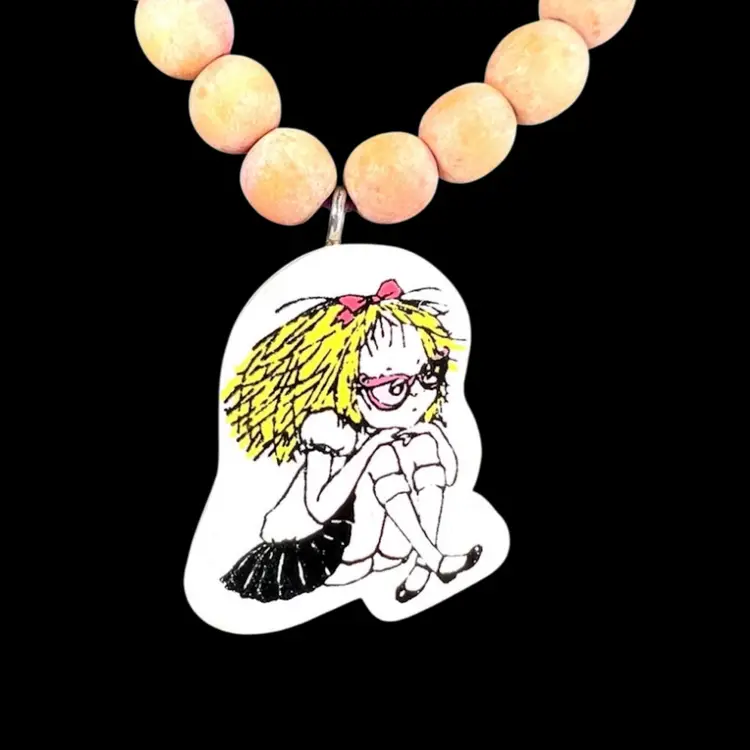 ELOISE The Classic Collection Wood Beaded Stretch Necklace.
Based on the 1950s Eloise Series of Children’s Books.