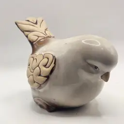 Pottery bird Figurine with scroll design wings