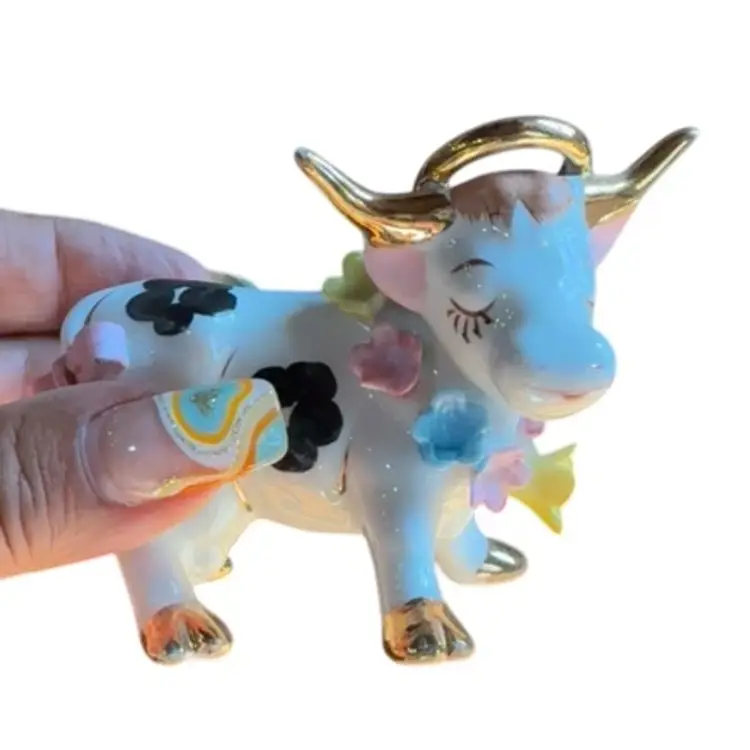 Cow porcelain figurine with flowers