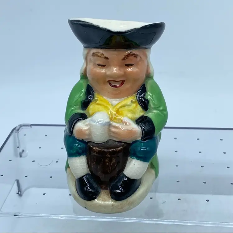 A vintage Burlington Ware ceramic Toby Jug depicting a jovial man with a mug England