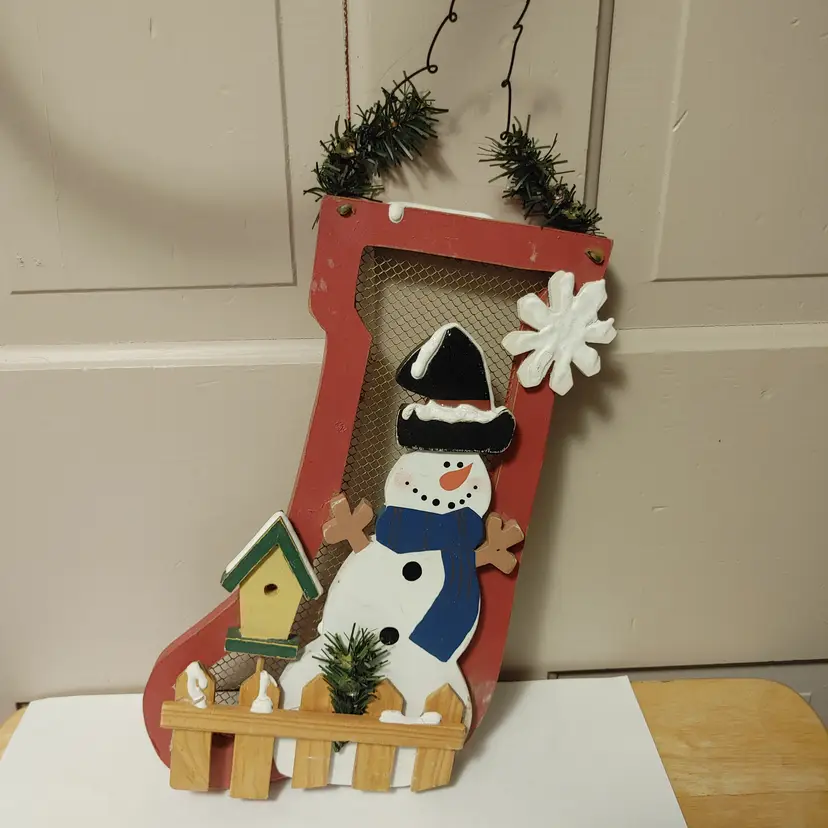 Hanging decor. Wood snowman on wood stocking. 17 inches from top of hanger to bottom of stocking.