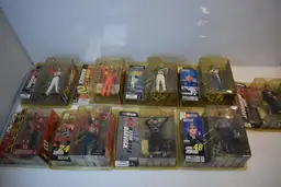 Lot of 9 Mcfarlane NASCAR action figures. All new in package. Package wear