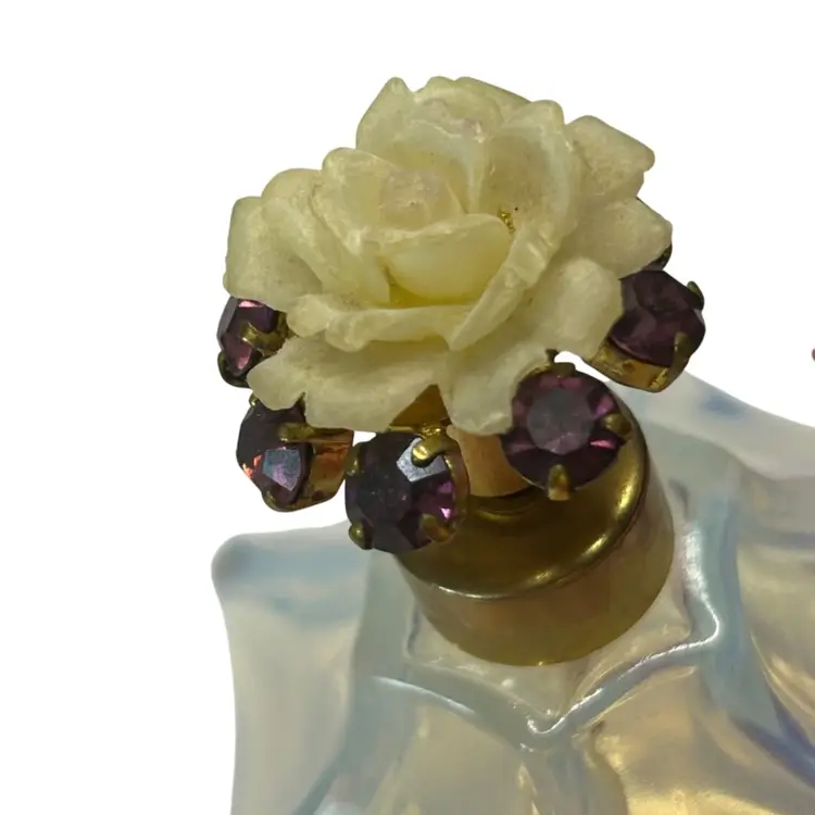 Vintage Made In France Opalescent Glass Perfume Bottle With Amethyst Colored Glass Gemstones With Resin Type White Rose (couple Of Chips On Rose) Not Sure If A Complete Bottle Or Missing Atomizer 
@ 3 1/2” Tall Slight Perfume Smell