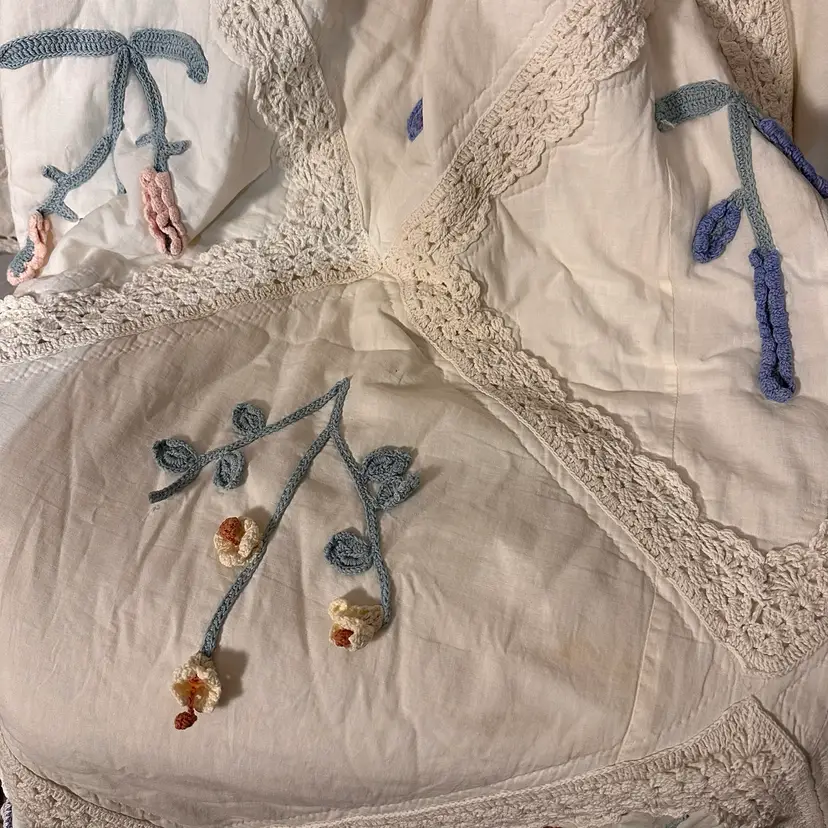 A Gorgeous Quilt With Crochet Florals