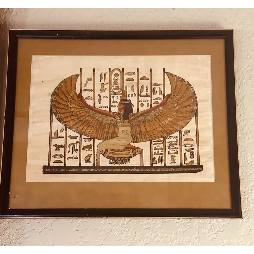 88. Framed papyrus painting showing the goddess Isis. Egyptian figure with large wings.