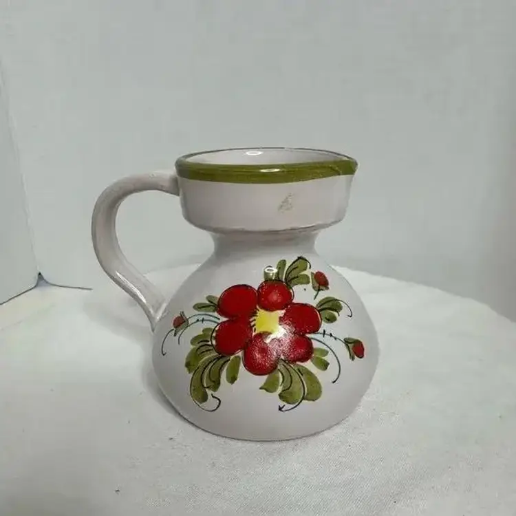 Hand painted Small Ceramic Floral Art Pottery Jug/Creamer. Small chip on handle. (A)