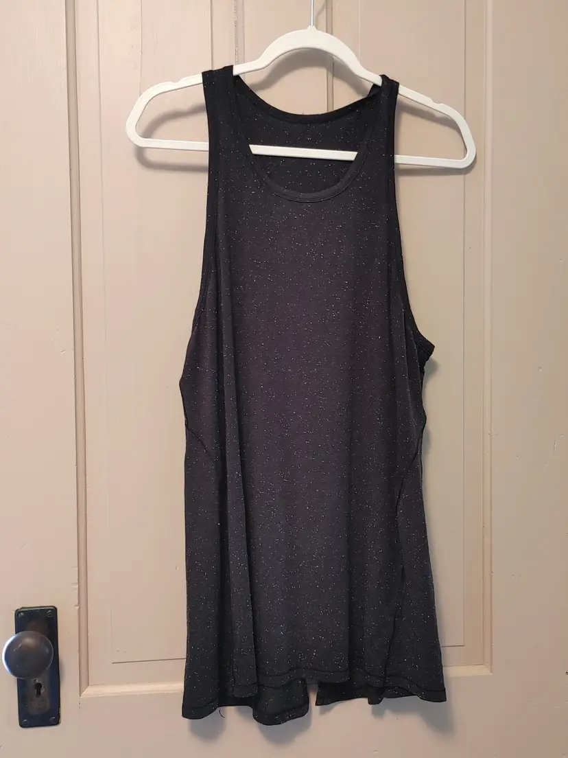 Top- Brand: LuLuLemon. Size unknown. Black tunic top. Material- unknown. No callouts.