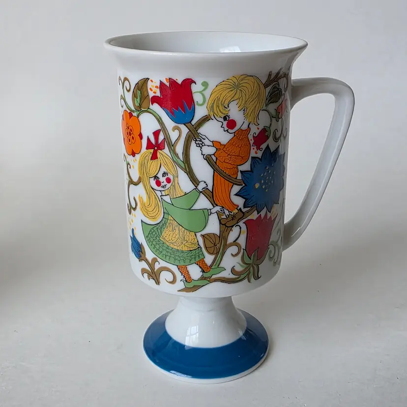Vintage Porcelain Footed Mug by Royal Crown "Flower Children" by T. Jones #2813