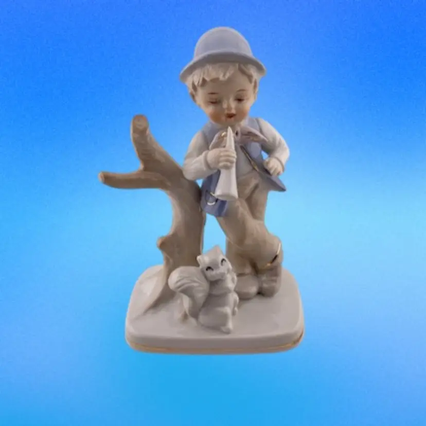 Vintage Porcelain Boy Figurine with Squirrel and Horn  With Gold Trim