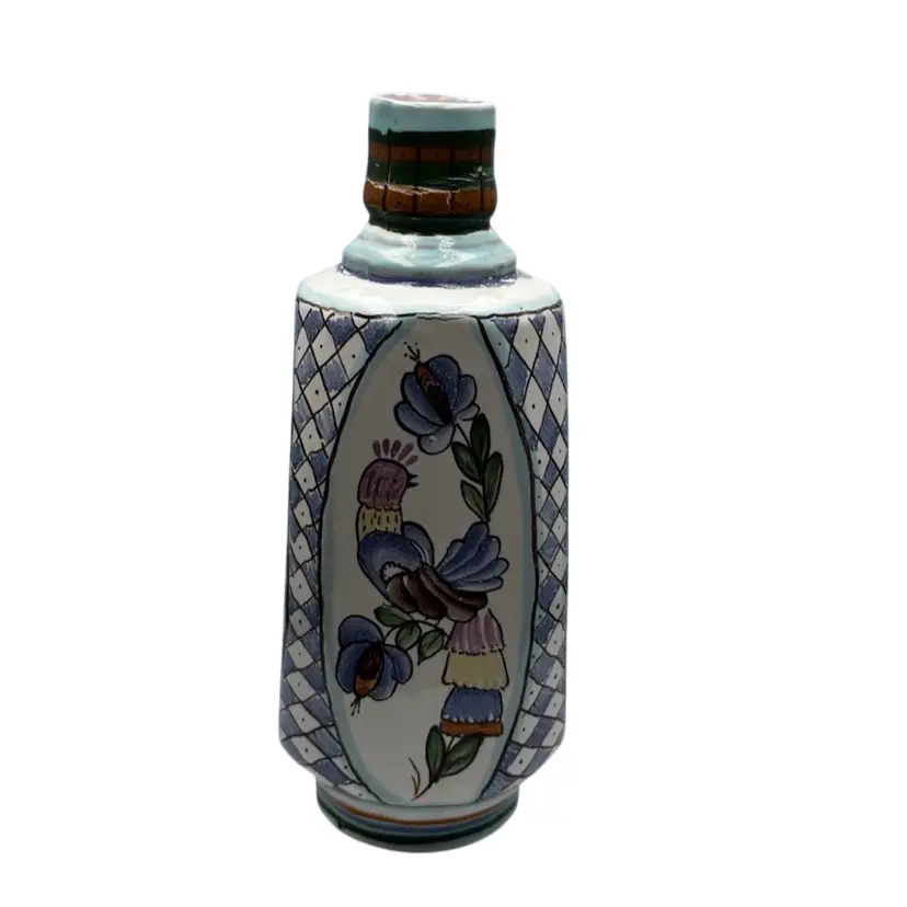 Hand-painted ceramic vase featuring a bird and floral motif.