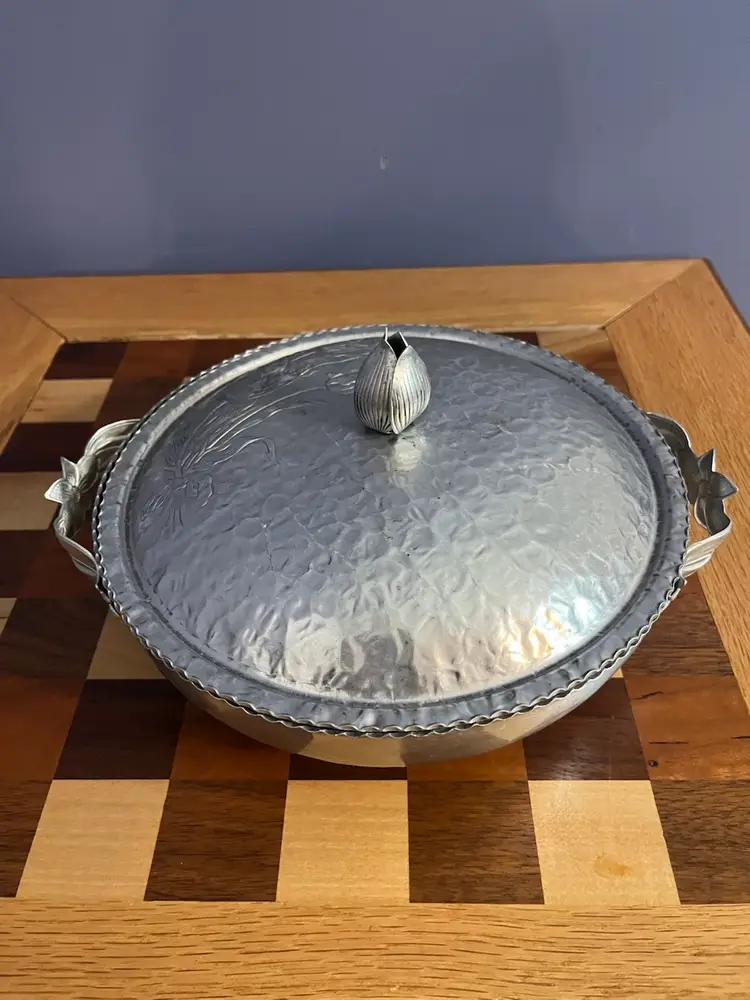 Vintage Rodney Kent hammered aluminum serving dish with tulip motif.
10 “ in Diameter 3 Inches High