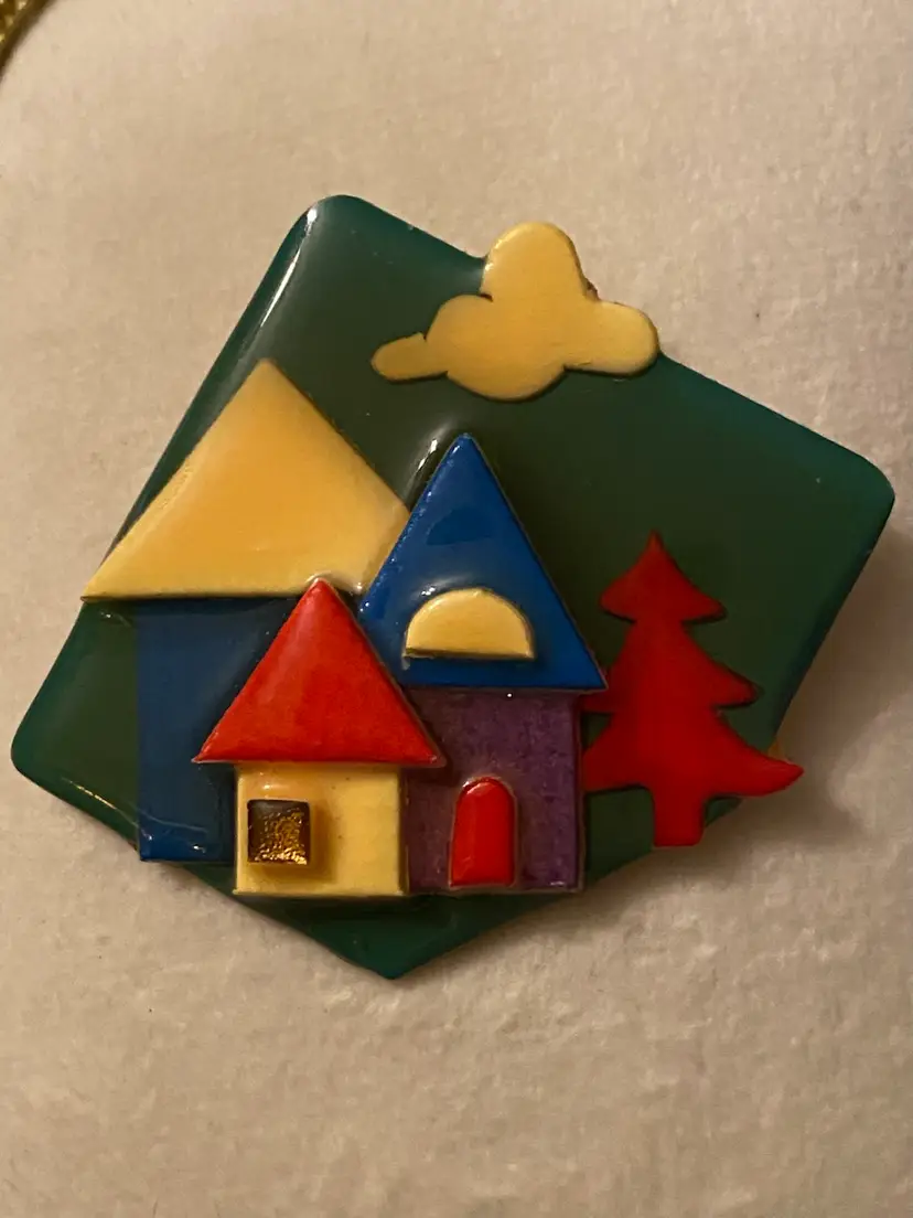 LUCINDA House Pin - Green Background With 2 Houses In All The Primary Colors ~ Red, Yellow, Blue Ans Purple With A Yellow Cloud And Red Tree